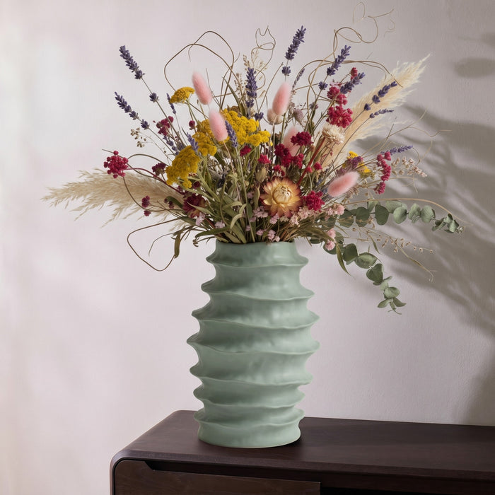 Organic Rib Vase - Sage sculptural sage green ribbed vase styled with a colourful dried floral arrangement.