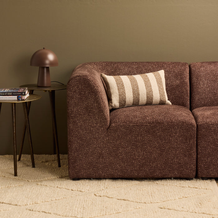 Benton 30x50cm Cushion - Brown Stripe, textured striped cushion styled on a chocolate brown sofa beside a table lamp.