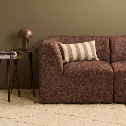 Benton 30x50cm Cushion - Brown Stripe, textured striped cushion styled on a chocolate brown sofa beside a table lamp.