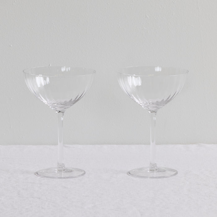 Bravo Coupe Glass Set - 2pc - Clear, two clear lightly fluted cocktail coupe glasses with slender stems.