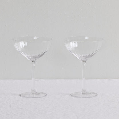 Bravo Coupe Glass Set - 2pc - Clear, two clear lightly fluted cocktail coupe glasses with slender stems.