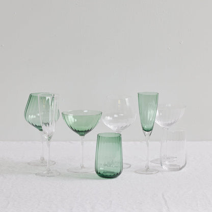 Bravo Coupe Glass Set - 2pc - Green, soft green coupes with clear stems styled among coordinating glassware.