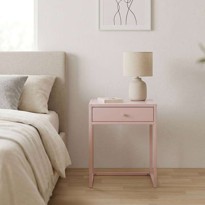 Irvine Nightstand - Pink, compact pink bedside table with single drawer, styled beside a bed with a table lamp.
