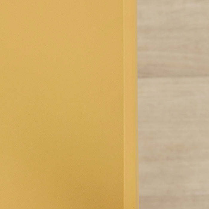 Kip Counter Stool - Yellow close-up of the mustard finish beside light timber flooring