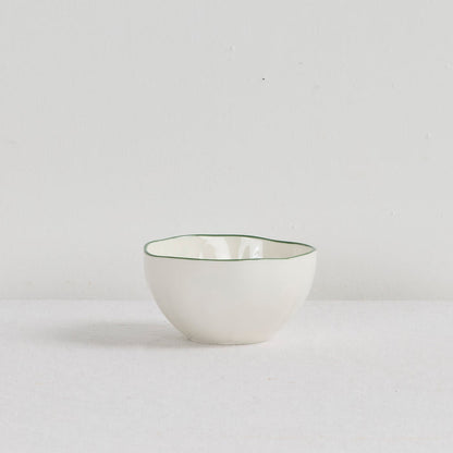 Lotus Snack Bowl - White/Green, small white dinnerware bowl with a fine green rim on a neutral surface