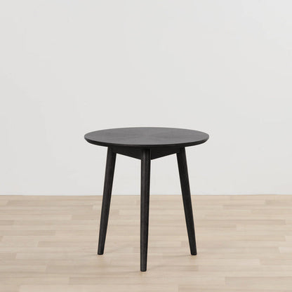 Orlando Large Side Table - Black round black side table with tapered legs on a light timber floor