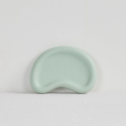 Pebble Small Tray - Sage, small sage green organic-shaped tray with a raised rim and smooth food-safe finish