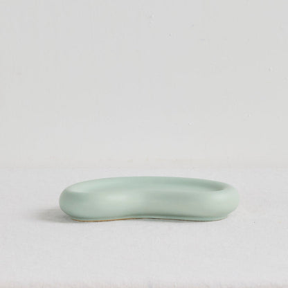 Pebble Small Tray - Sage, low organic-shaped sage green tray with a smooth matte finish and raised rim