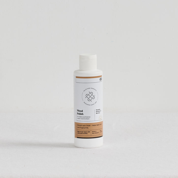 Pelle Wood Polish - 250ml nourishing cream for finished indoor wood in a white bottle with satin finish label