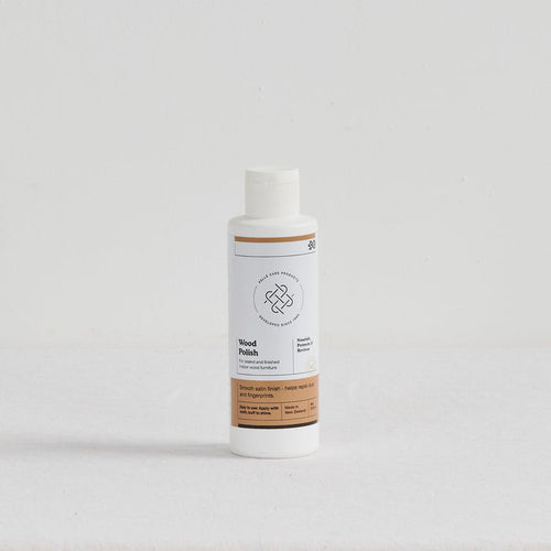 Pelle Wood Polish - 250ml nourishing cream for finished indoor wood in a white bottle with satin finish label