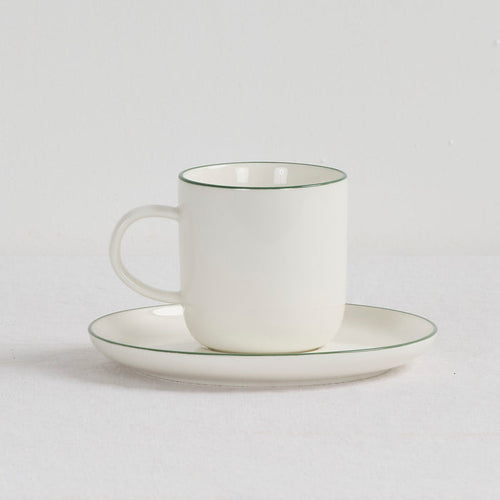 Soma Coffee Cup & Saucer - White/Green white dinnerware set with fine green rim detailing and rounded handle.