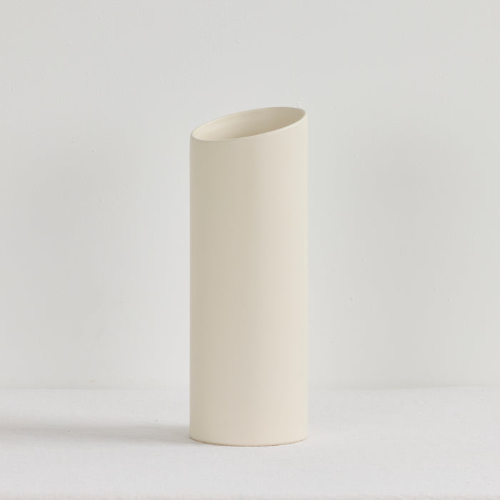 White ceramic vase on a light gray background