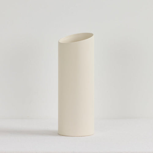White ceramic vase on a light gray background