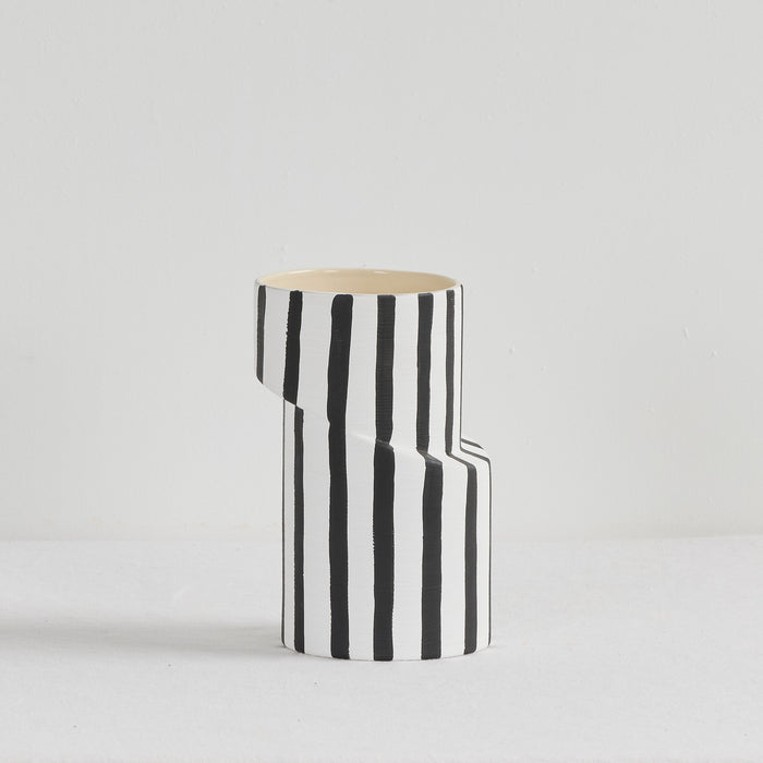 Twist Striped Medium Vase - White/Black, sculptural ceramic vase with bold vertical black stripes and an offset silhouette.