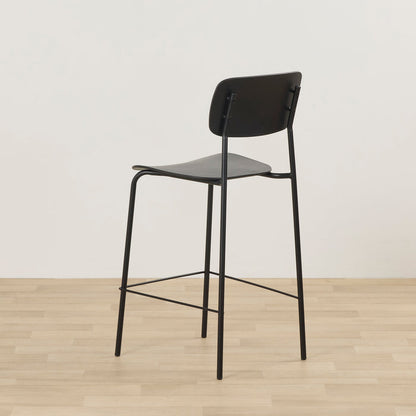 Vincent Counter Stool - Black, rear view of minimalist black counter stool with curved backrest and slim metal frame.