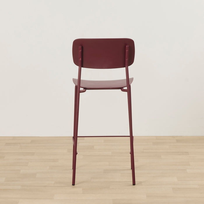 Vincent Counter Stool - Wine, rear view of a wine-coloured counter stool with curved backrest, slim metal legs and footrest.